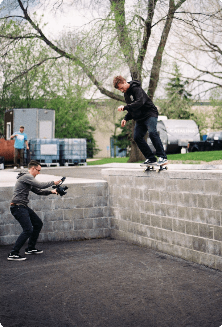 Me filming a 50-50 on a tall retaining wall